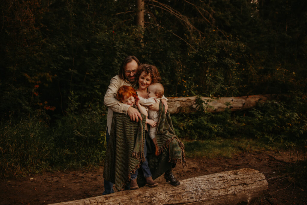 family cuddles during a fall family photo session in Edmonton