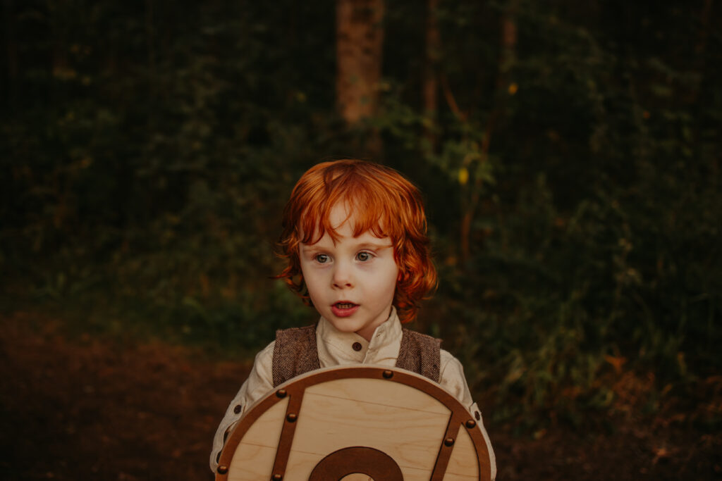 little boy with bright red hair at edmonton family photo session