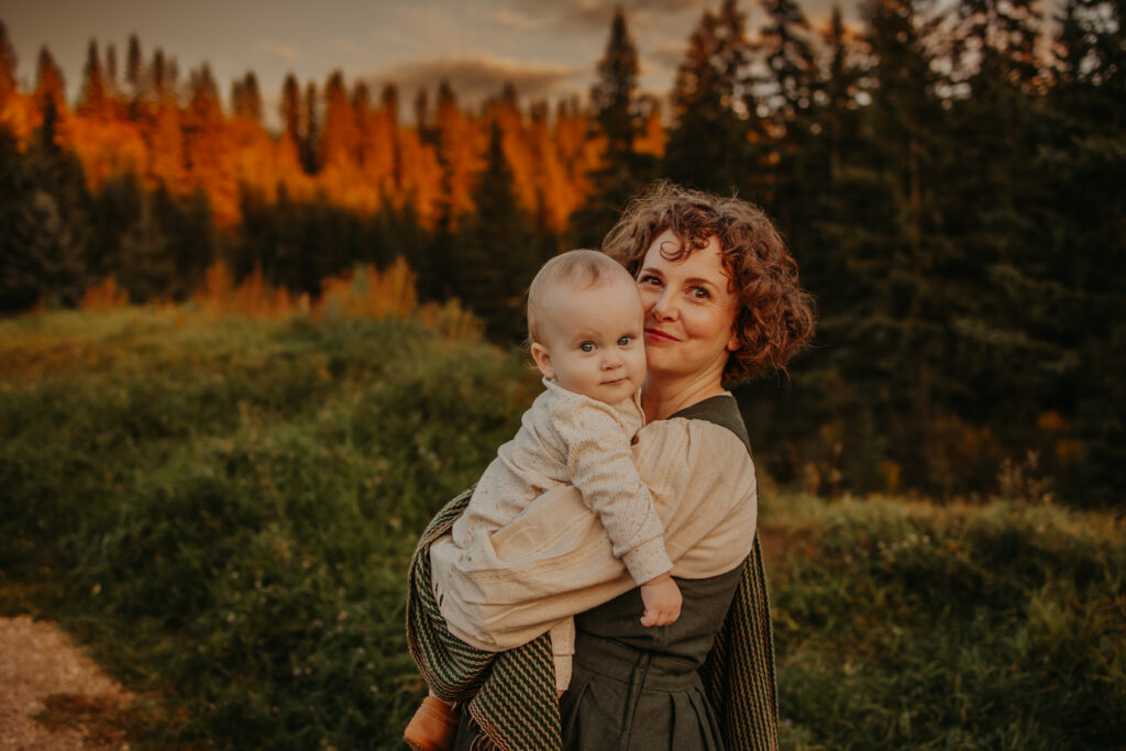 mom holds baby during fall family photo shoot in edmonton