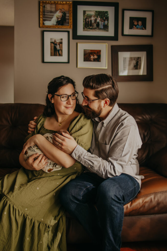 mom and dad look at each other during Edmonton newborn photo session