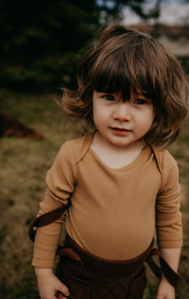 boy at outdoor edmonton newborn photo session