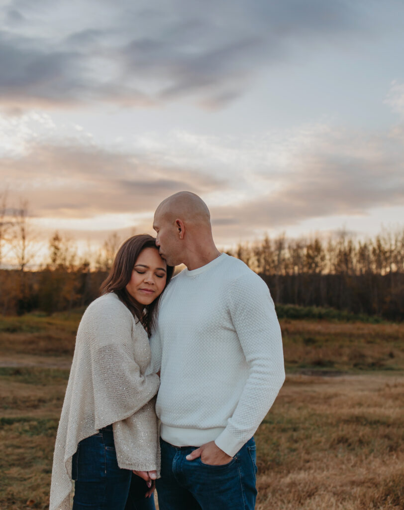 mon and dad post for fall edmonton family photos in the river valley