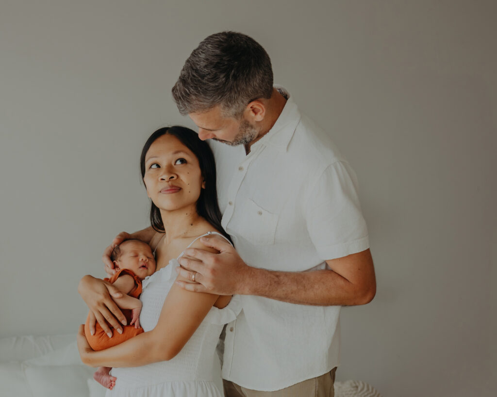 edmonton family poses for newborn photos