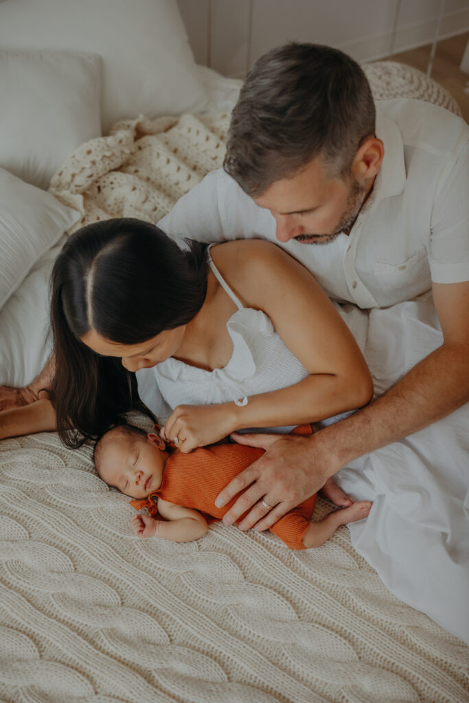 edmonton family poses for newborn photos